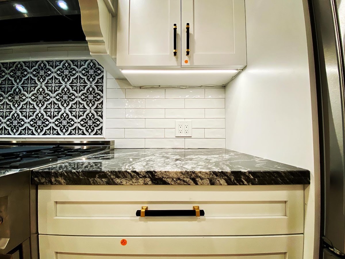 Finished kitchen with under-cabinet lighting wired by Inrush Electric